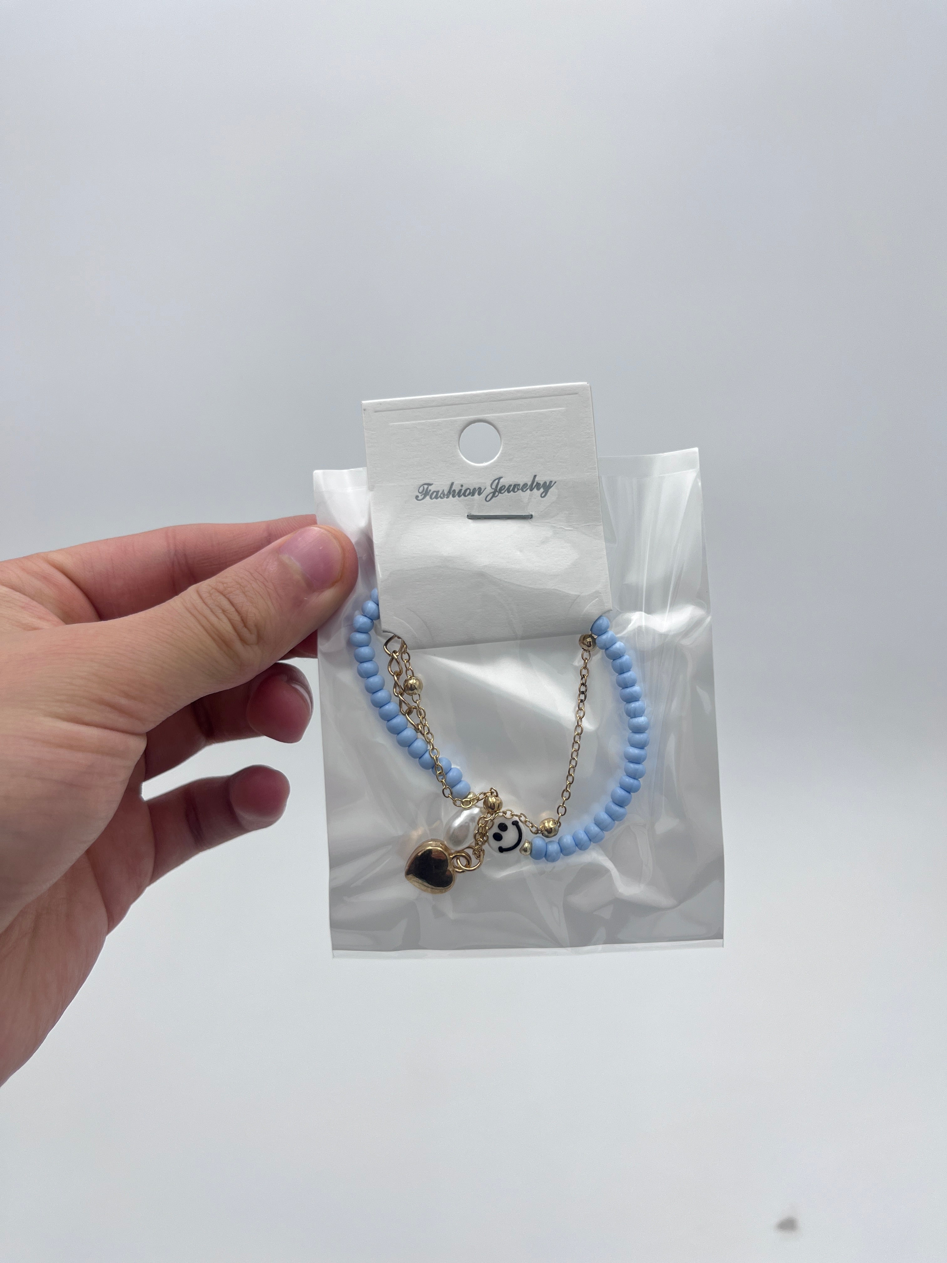 Pulsera Doble Capa con Cuentas y Carita Feliz Azul - Paquete de 12 piezas 14.08 c/u