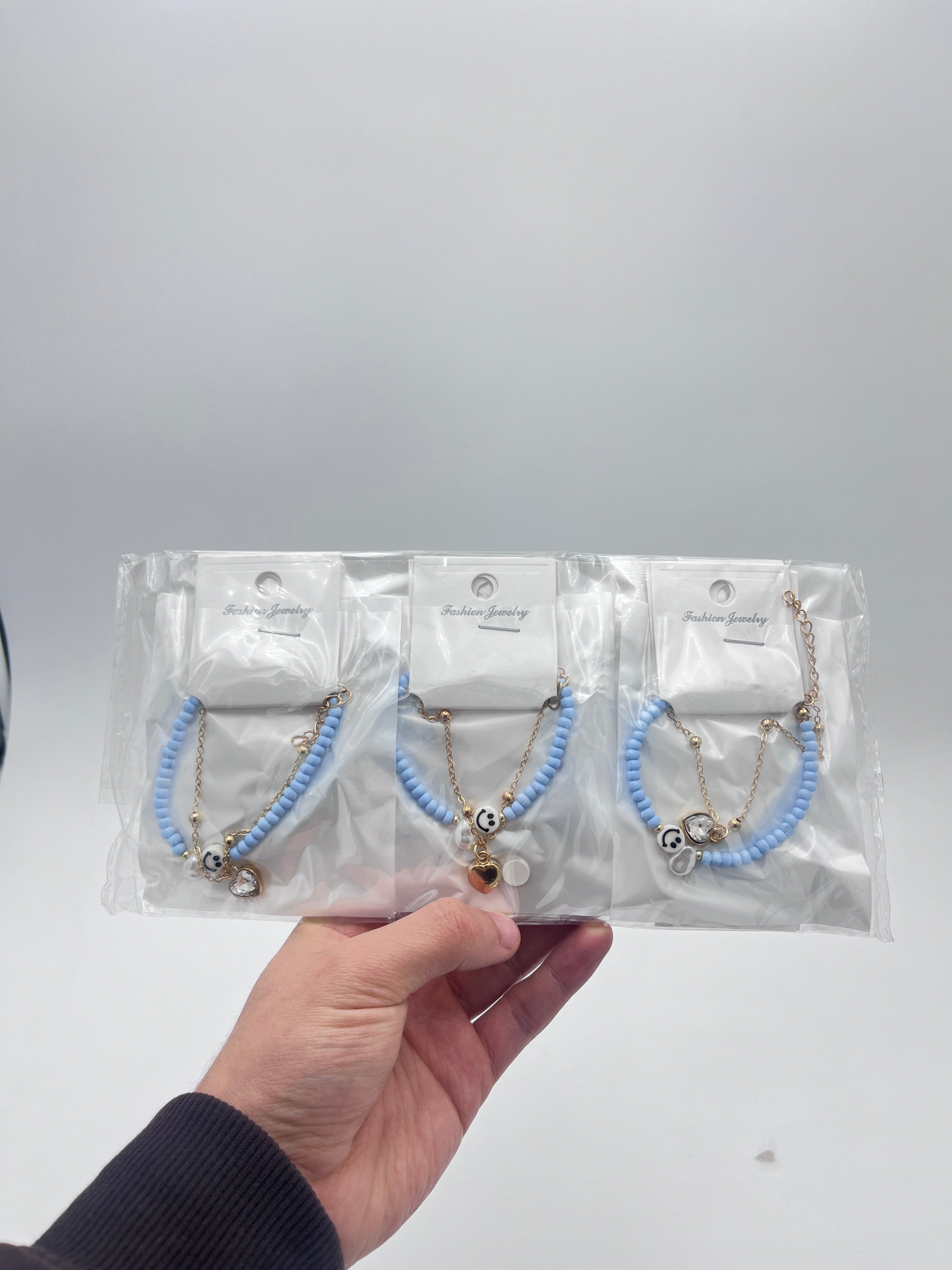 Pulsera Doble Capa con Cuentas y Carita Feliz Azul - Paquete de 12 piezas 14.08 c/u