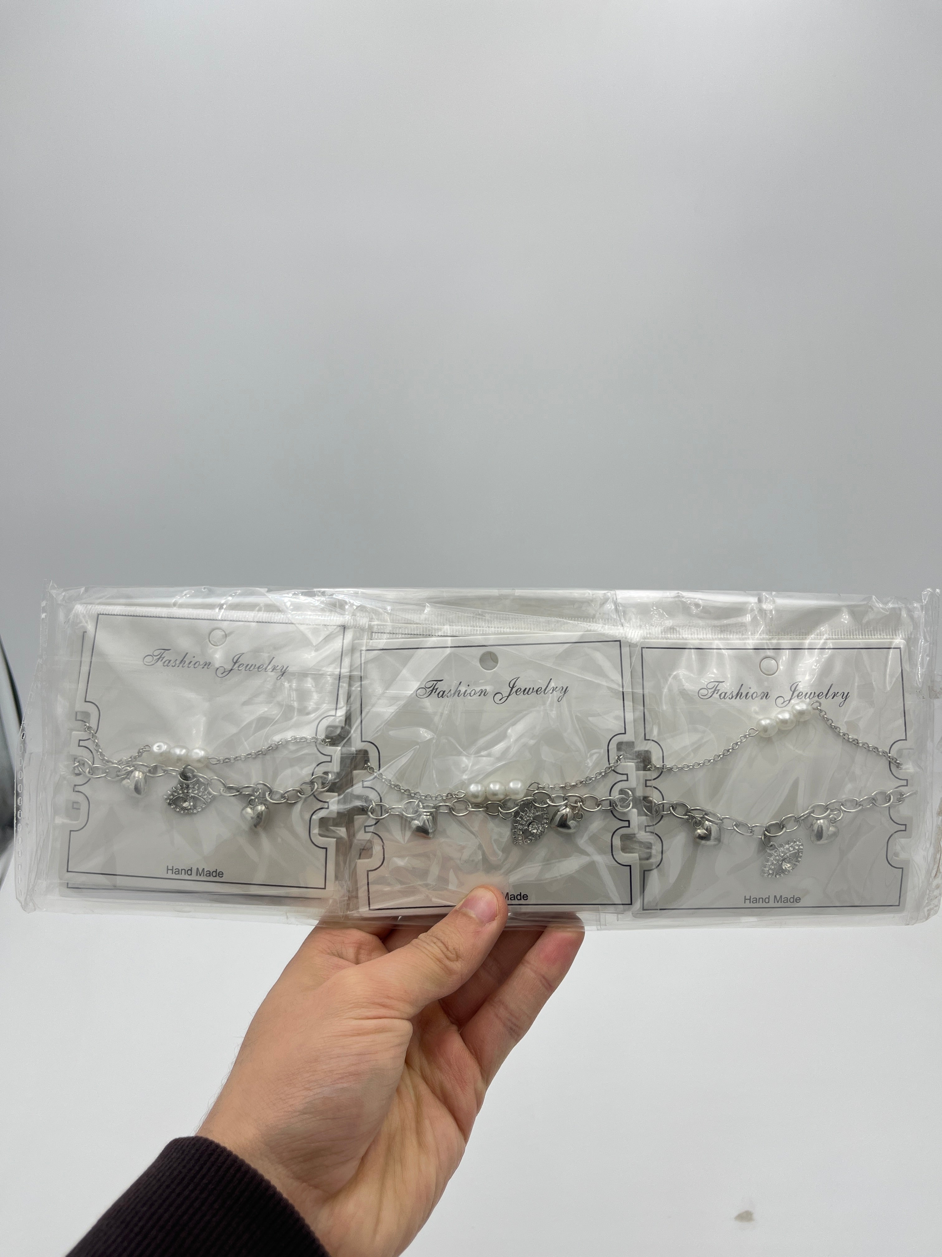 Pulsera Doble Plateada Ojo - Paquete de 12 piezas 14.08 c/u