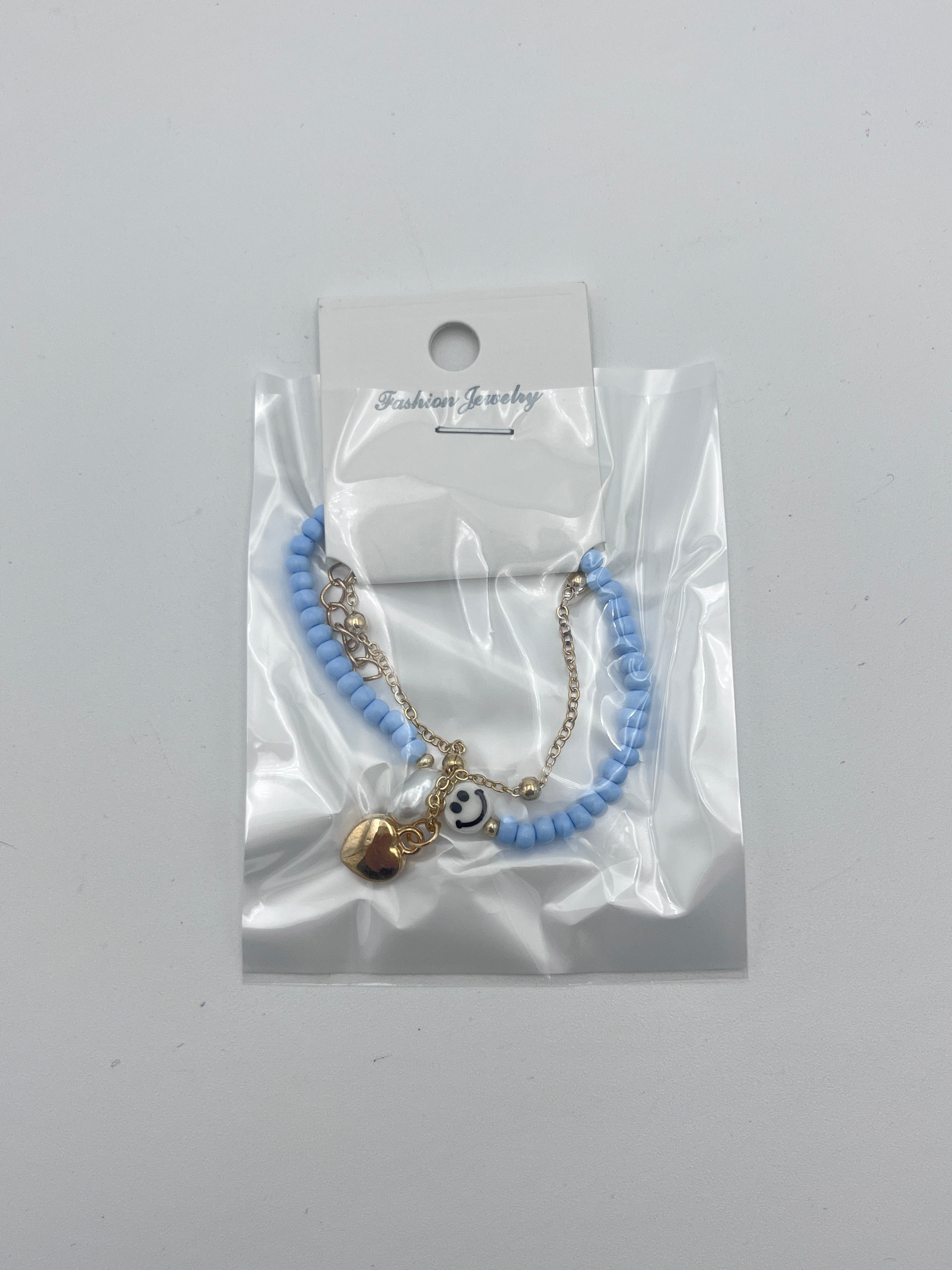 Pulsera Doble Capa con Cuentas y Carita Feliz Azul - Paquete de 12 piezas 14.08 c/u